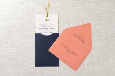 Elegant and Formal Nautical Sliding Pocket Wedding Invitation with Anchor Charm Ribbon Embellishment in Ivory, Navy Blue, Coral, and Antique Gold - Chicago Wedding Invitations