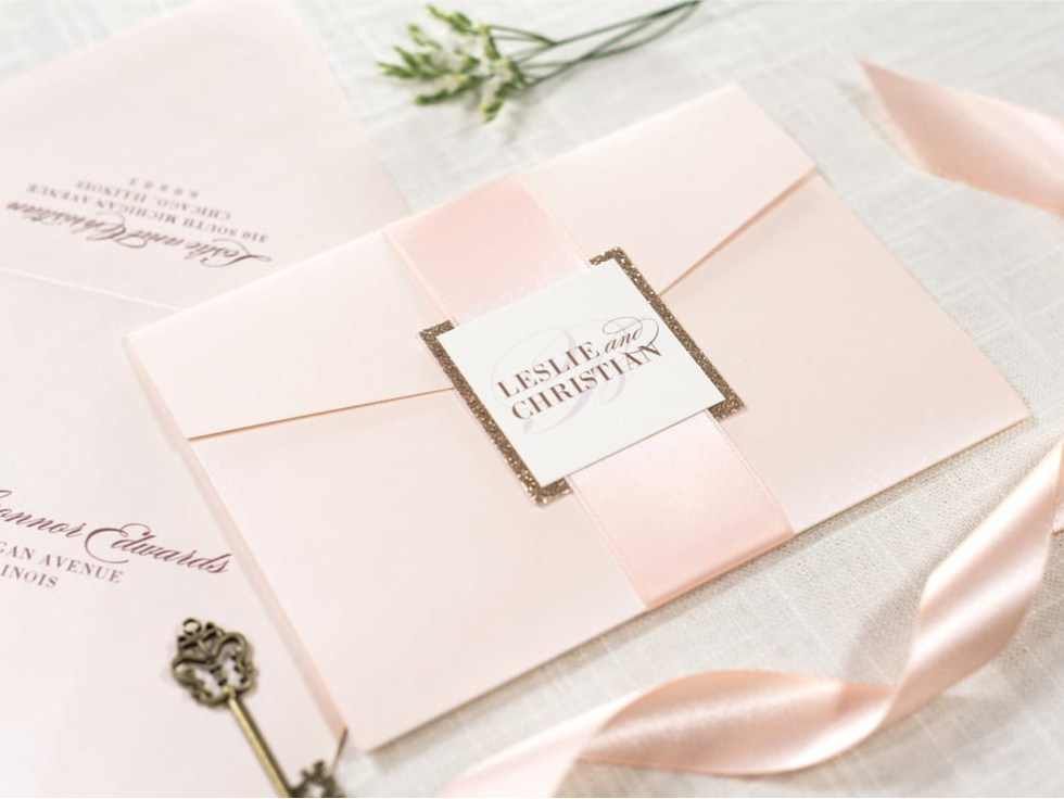 ELEGANT AND FORMAL IVORY, ROSE GOLD GLITTER, AND BLUSH METALLIC SHIMMER POCKETFOLD WEDDING INVITATION SUITE WITH SATIN RIBBON BELLY BAND AND MONOGRAM SQUARE