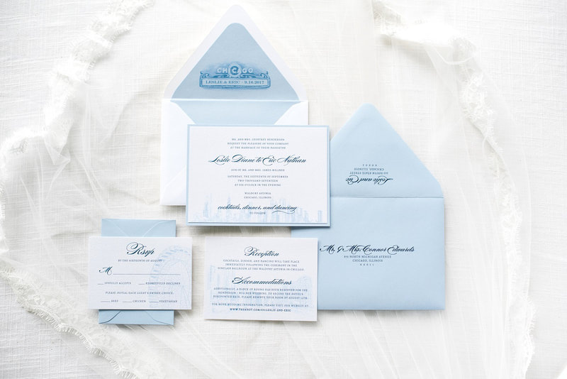 chicago skyline elegant and formal wedding invitation with chicago theatre theater sign pale dusty french blue white shimmer 