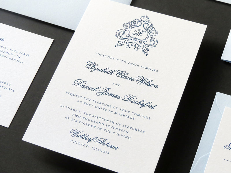 elegant and formal ornate monogram crest wedding invitation in white, pale / serenity blue and ice silver - chicago wedding invitations