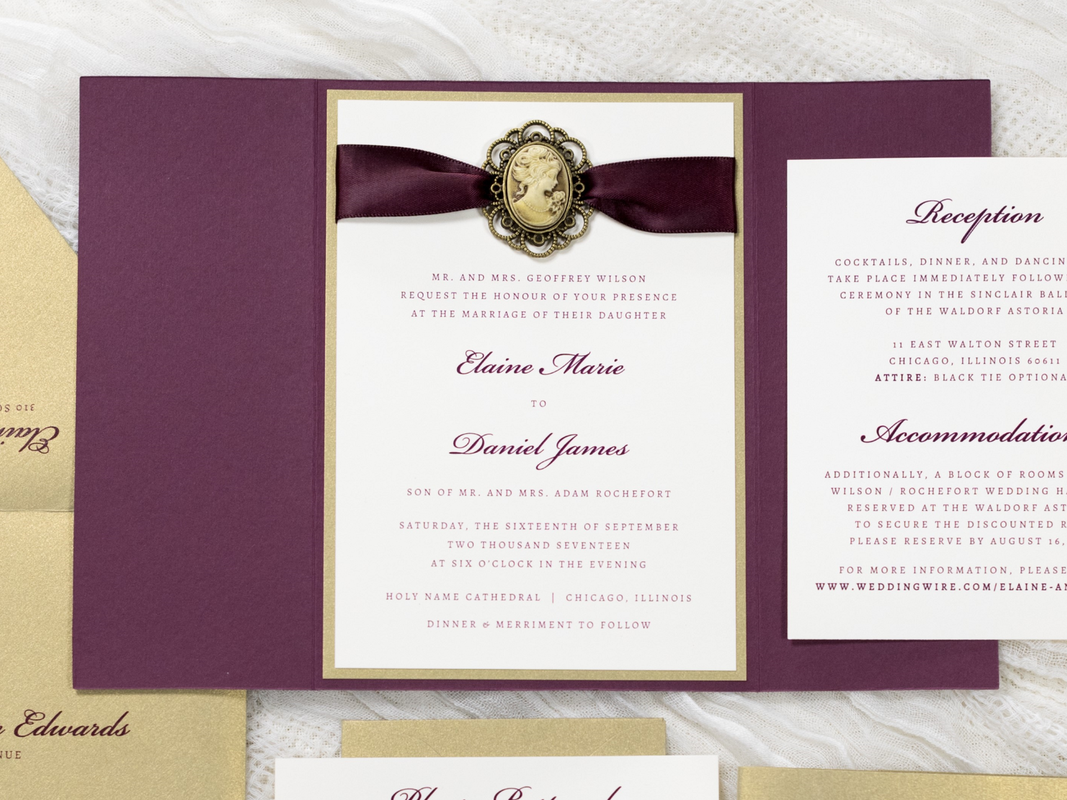 ELEGANT AND FORMAL GATEFOLD WEDDING INVITATION WITH VINTAGE STYLE CAMEO SILHOUETTE RIBBON EMBELLISHMENT IN IVORY, GOLD LEAF, AND WINE BURGUNDY