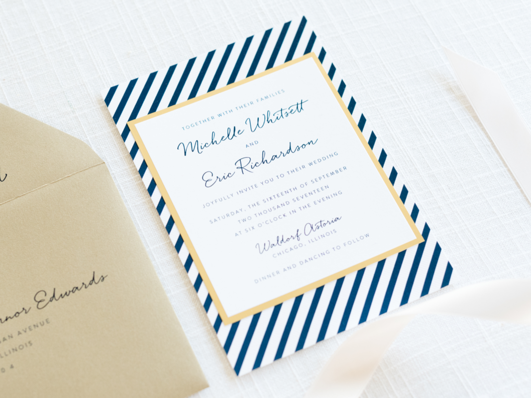 modern nautical wedding invitation layered with navy blue stripe pattern, gold foil, gold shimmer, and white