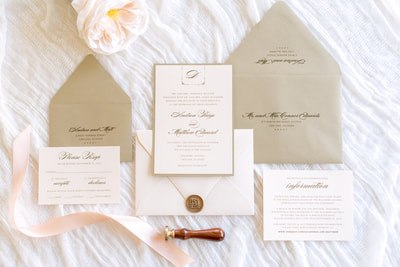 soft blush and gold shimmer luxury wedding invitation with elegant monogram crest and wax seal - chicago wedding invitations