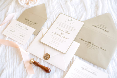 soft blush and gold shimmer luxury wedding invitation with elegant monogram crest and wax seal - chicago wedding invitations